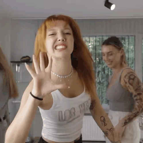 Woman with Red Hair in White Love Tank Top