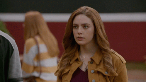 Woman With Red Hair in Yellow Jacket