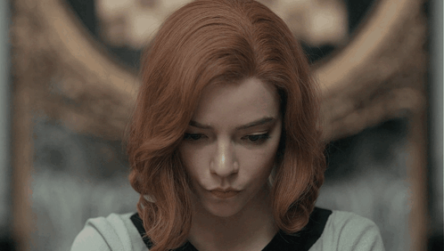 Woman With Red Hair Looking at Camera