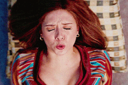 Woman With Red Hair Making Funny Face GIF