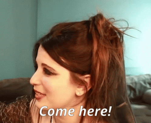 Woman with Red Hair Saying Come Here