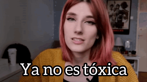 Woman With Red Hair Says Ya No Es Toxica in Yellow Sweater