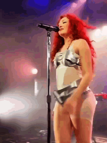 Woman With Red Hair Singing On Stage GIF