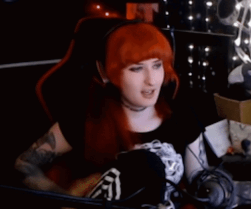Woman With Red Hair Sitting In Gaming Chair GIF