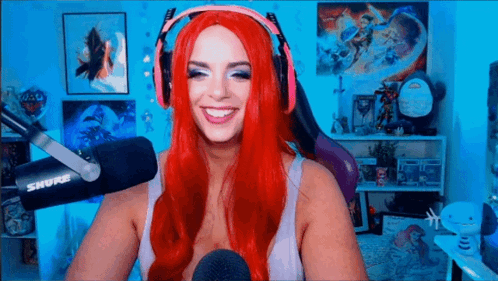 Woman With Red Hair Smiling At Microphone GIF