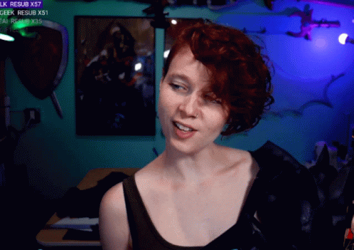 Woman With Red Hair Smiling in Front of Geek Resub X57