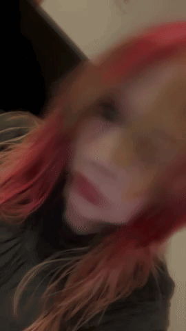 Woman With Red Hair Taking Selfie