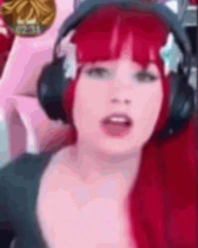 Woman with Red Hair Wearing Headphones