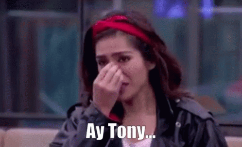 Woman with Red Headband Crying and Covering Face