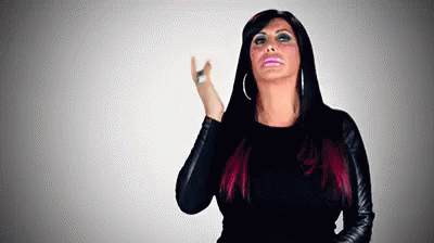 Woman With Red-Highlighted Black Hair in Black Jacket Making Funny Face