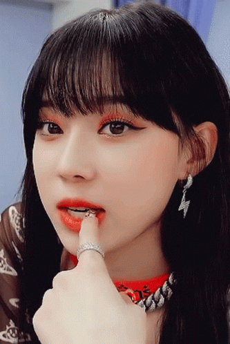 Woman With Red Lips and Ring