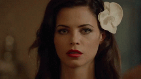 Woman With Red Lipstick and White Flower in Hair