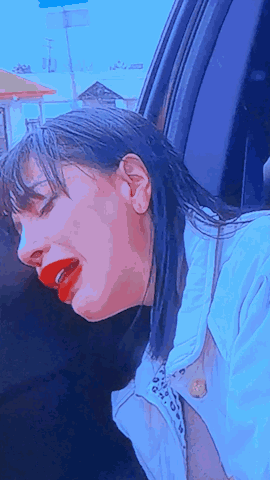 Woman With Red Lipstick Head Out Car Window