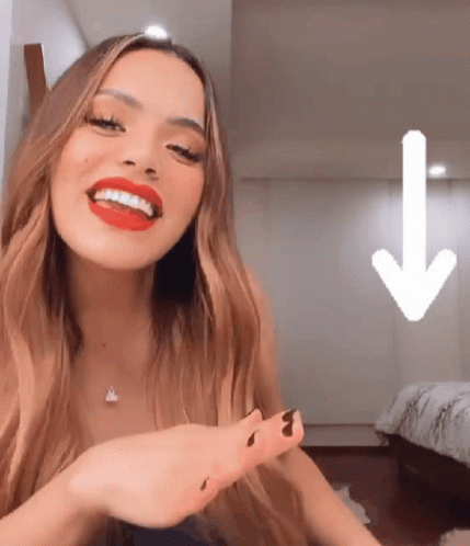 Woman with Red Lipstick Smiling with Down Arrow