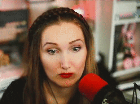 Woman with Red Lipstick Talking Into Microphone