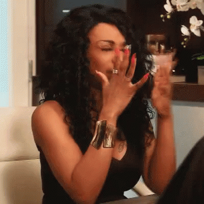 Woman With Red Nails And Ring Covering Mouth GIF