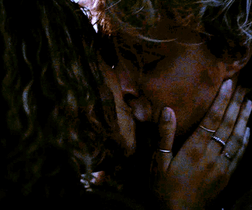 Woman With Rings Kissing Another Woman on Forehead
