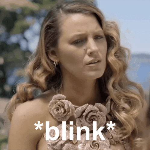 Woman With Rose Necklace Saying Blink