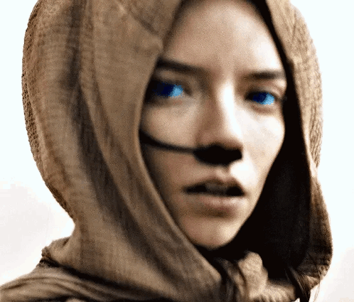 Woman With Scarf Around Head And Blue Eyes