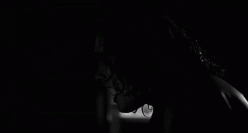 Woman with Scary Face in Darkness