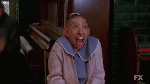 Woman With Shaved Head Making Funny Face GIF