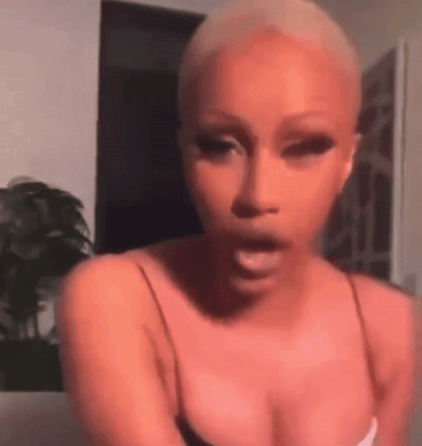 Woman With Shaved Head Making Funny Face