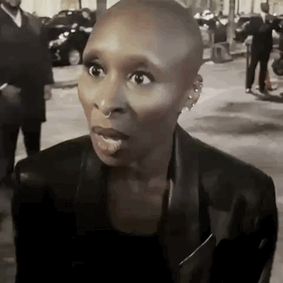 Woman With Shaved Head Making Funny Face GIF