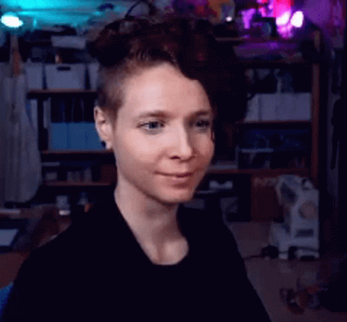 Woman With Shaved Head Smiling