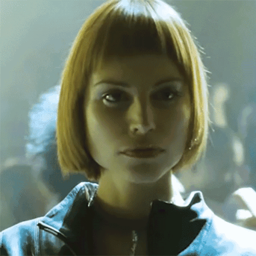 Woman with Short Blonde Hair Looking at Camera