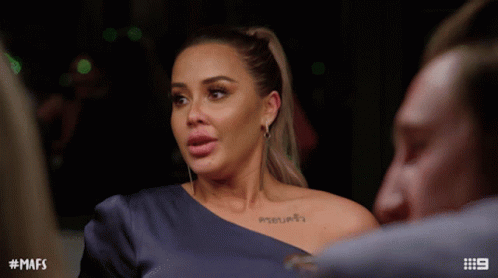 Woman With Shoulder Tattoo Talking To Man GIF