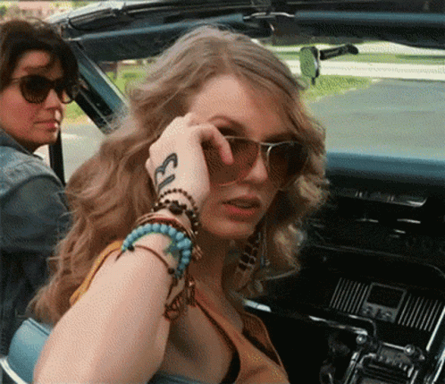 Woman With Sunglasses and Ecl Tattoo on Wrist