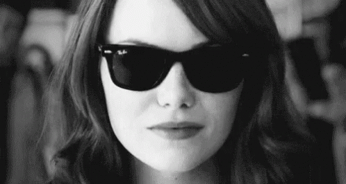 Woman With Sunglasses Making Funny Face Black And White GIF