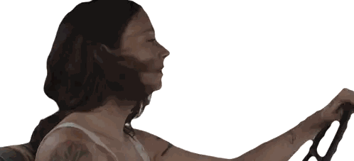 Woman with Tattoo Holding Steering Wheel
