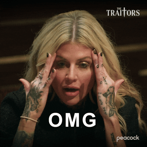 Woman With Tattooed Hands Holding Head Saying Omg