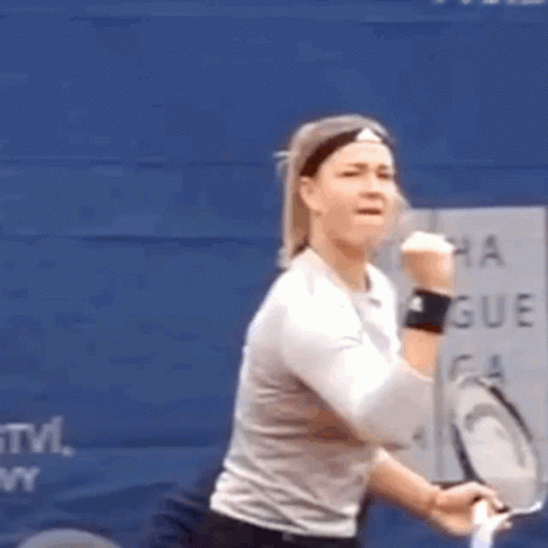Woman with Tennis Racquet at Blue Wall Saying Montreal Group