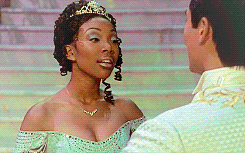 Woman With Tiara Next To Man In Suit GIF