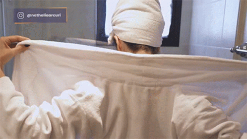 Woman With Towel on Head in Bathroom