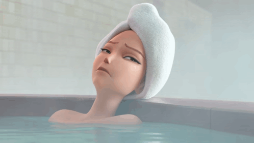 Woman With Towel on Head Laying in Bathtub