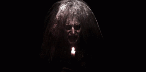 Woman With Veil Holding Candle GIF