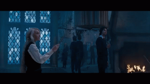Woman With Wand by Window Man With Wand Behind