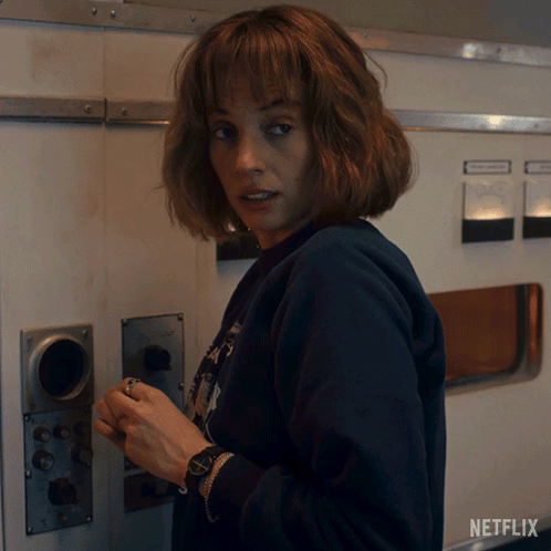 Woman With Watch Next to Netflix Logo