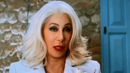 Woman with White Hair and Red Lipstick at Blue Door