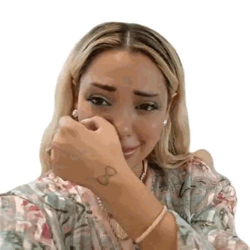 Woman With Wrist Tattoo Covering Face