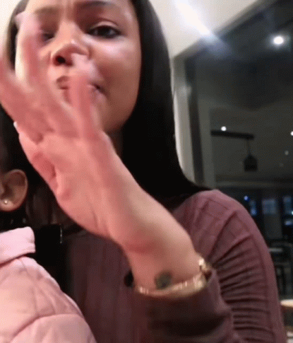 Woman with Wrist Tattoo Holding Child