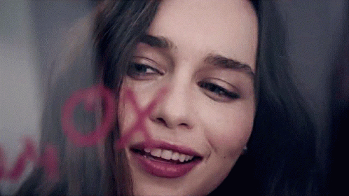 Woman With XOXO Painted on Face