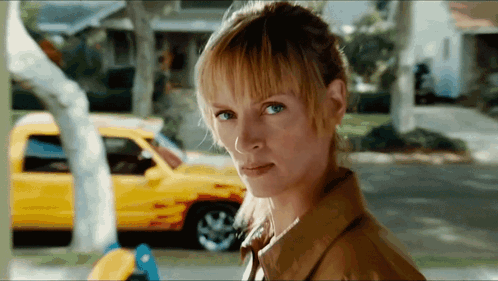 Woman With Yellow Car Behind GIF