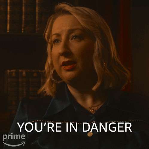 Woman With You're In Danger Text