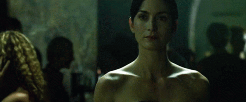Woman Without Shirt Looking at Camera
