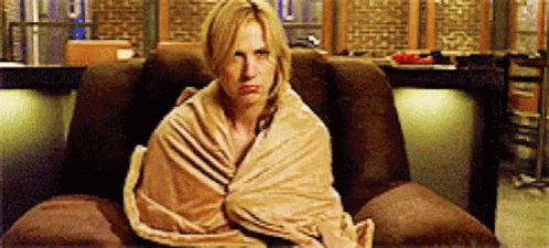 Woman Wrapped In Blanket In Chair GIF