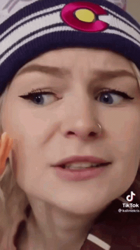 Woman Yellow Shirt On Couch Making Funny Face GIF